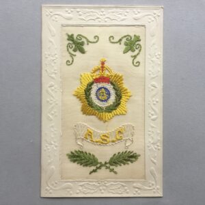 an embroidered silk postcard with an Army Service Corps cap badge